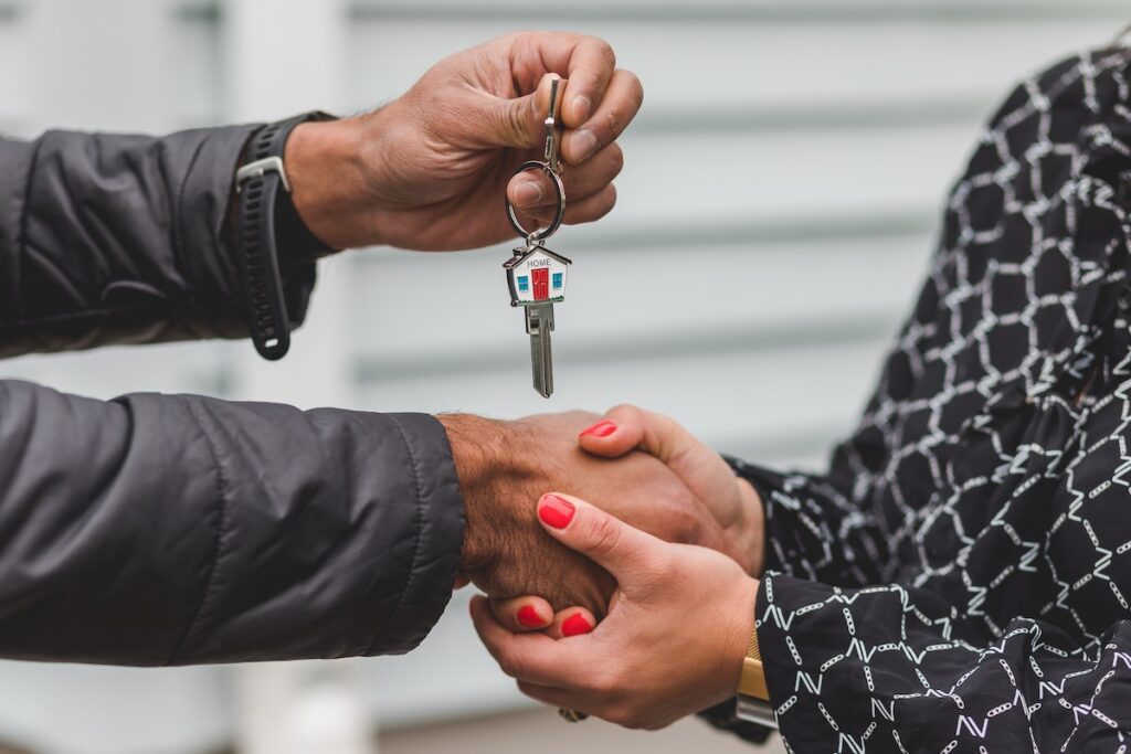 keys to a house being handed to buyer