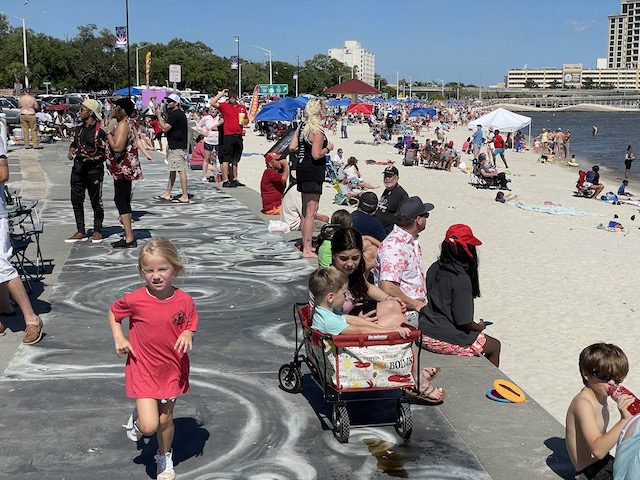 Biloxi main beach during air show lots of people